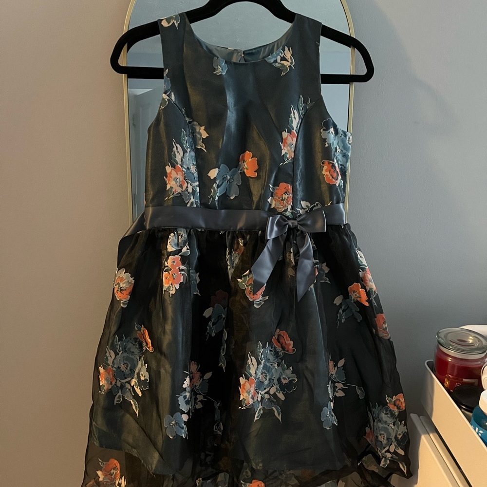multi-coloured dress with a bow and floral design